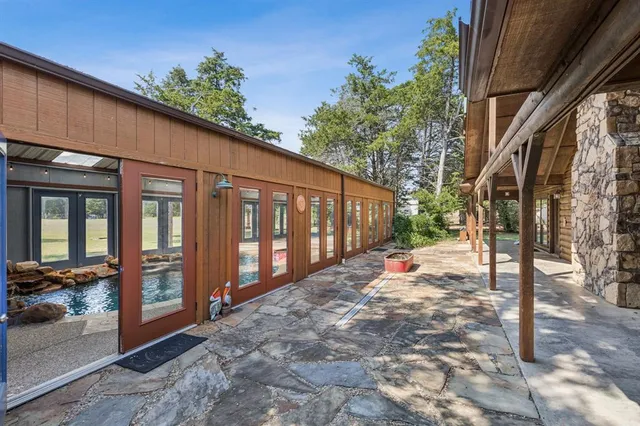 a large room with a large window and furniture