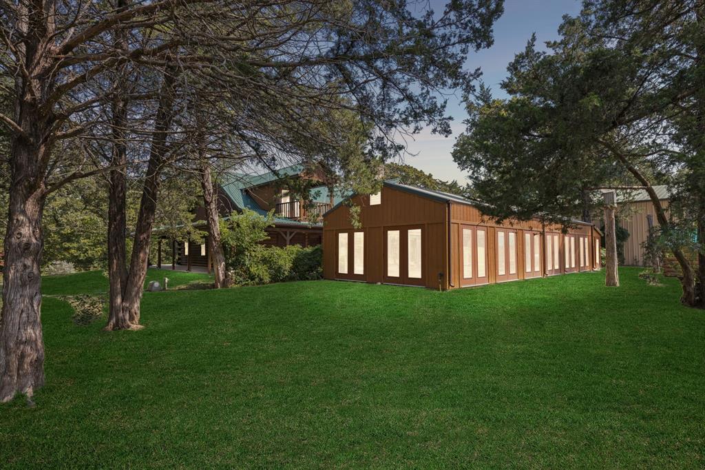 399 Tanglewood Trail Pottsboro, TX 75076 - Photo 38 of 39 a view of a yard with a large tree