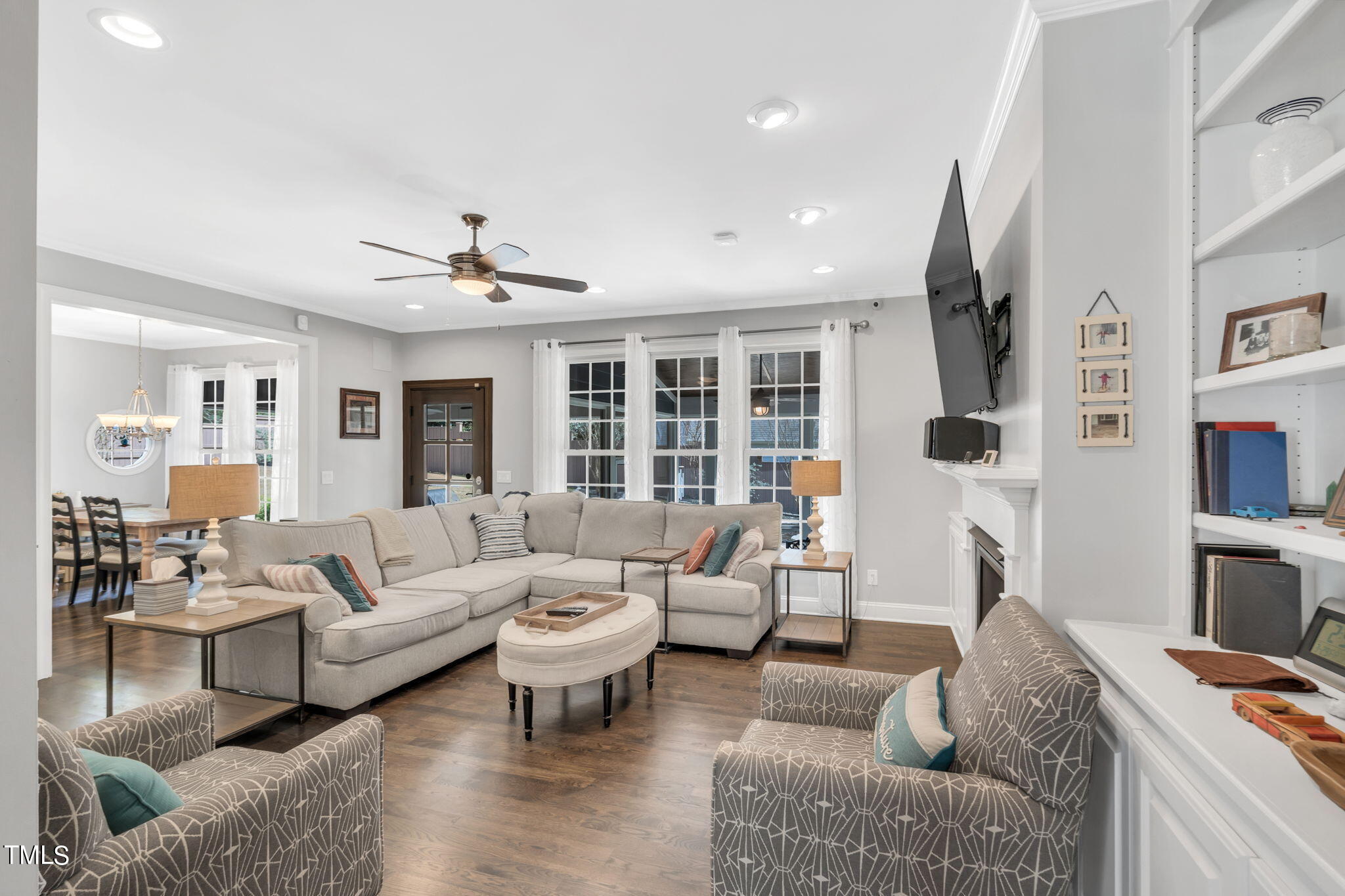 4301 Sprague Road Raleigh, NC 27613 - Photo 11 of 46 a living room with furniture and a flat screen tv
