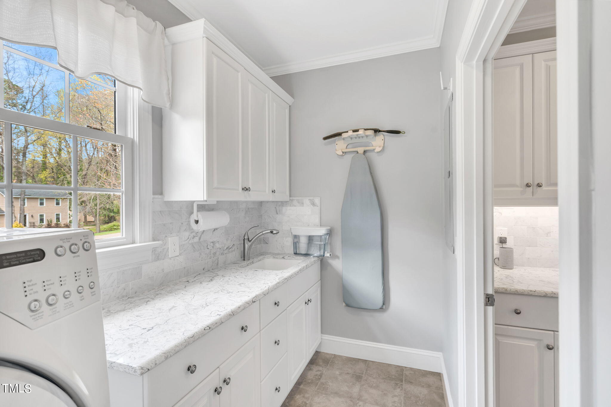 4301 Sprague Road Raleigh, NC 27613 - Photo 18 of 46 a bathroom with a granite countertop sink and a mirror