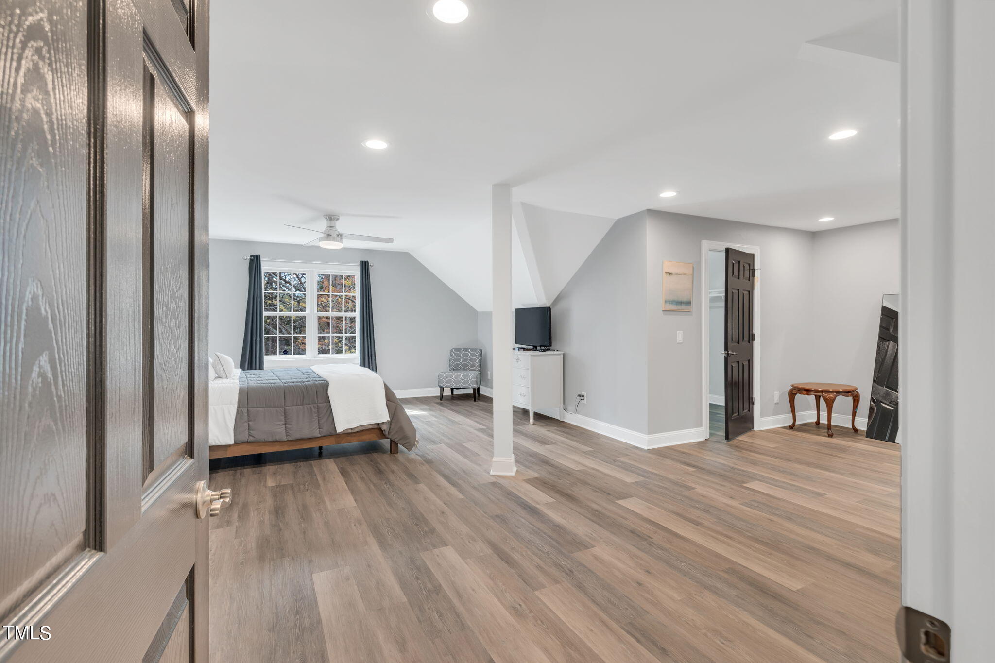 4301 Sprague Road Raleigh, NC 27613 - Photo 30 of 46 a bedroom with a bed and a large window