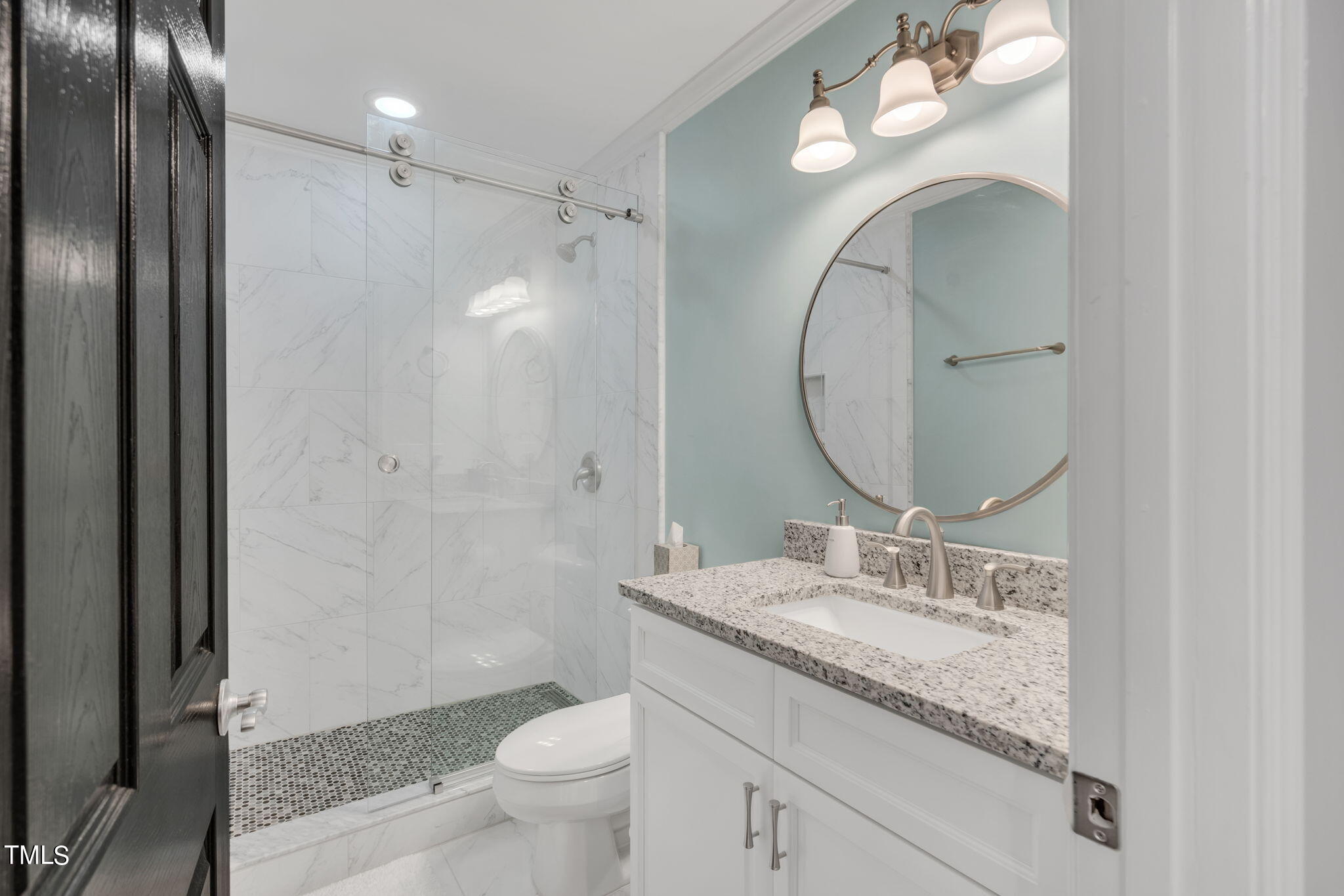 4301 Sprague Road Raleigh, NC 27613 - Photo 35 of 46 a bathroom with a granite countertop sink mirror toilet and shower
