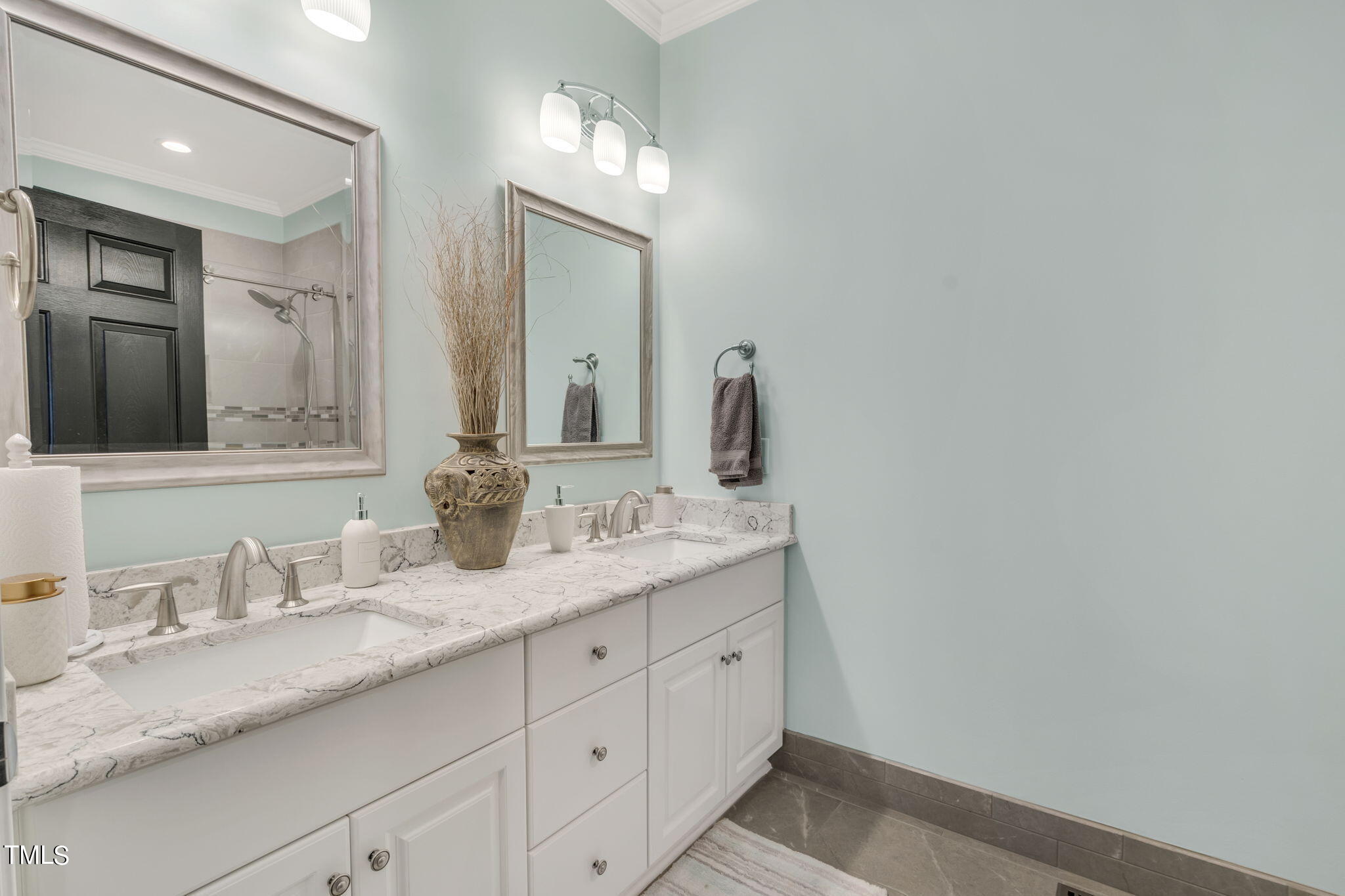 4301 Sprague Road Raleigh, NC 27613 - Photo 36 of 46 a bathroom with a granite countertop sink mirror and vanity