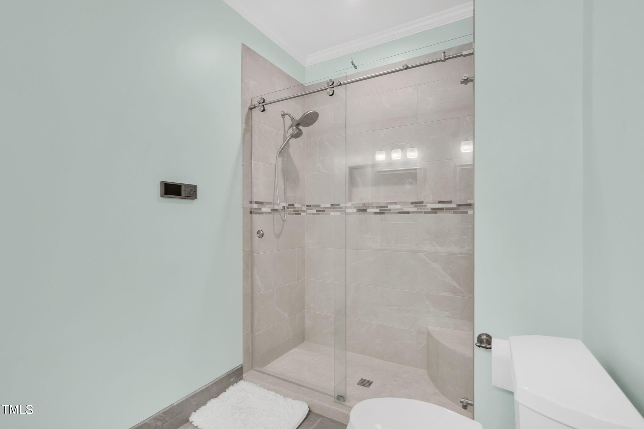 4301 Sprague Road Raleigh, NC 27613 - Photo 37 of 46 a bathroom with a shower and toilet