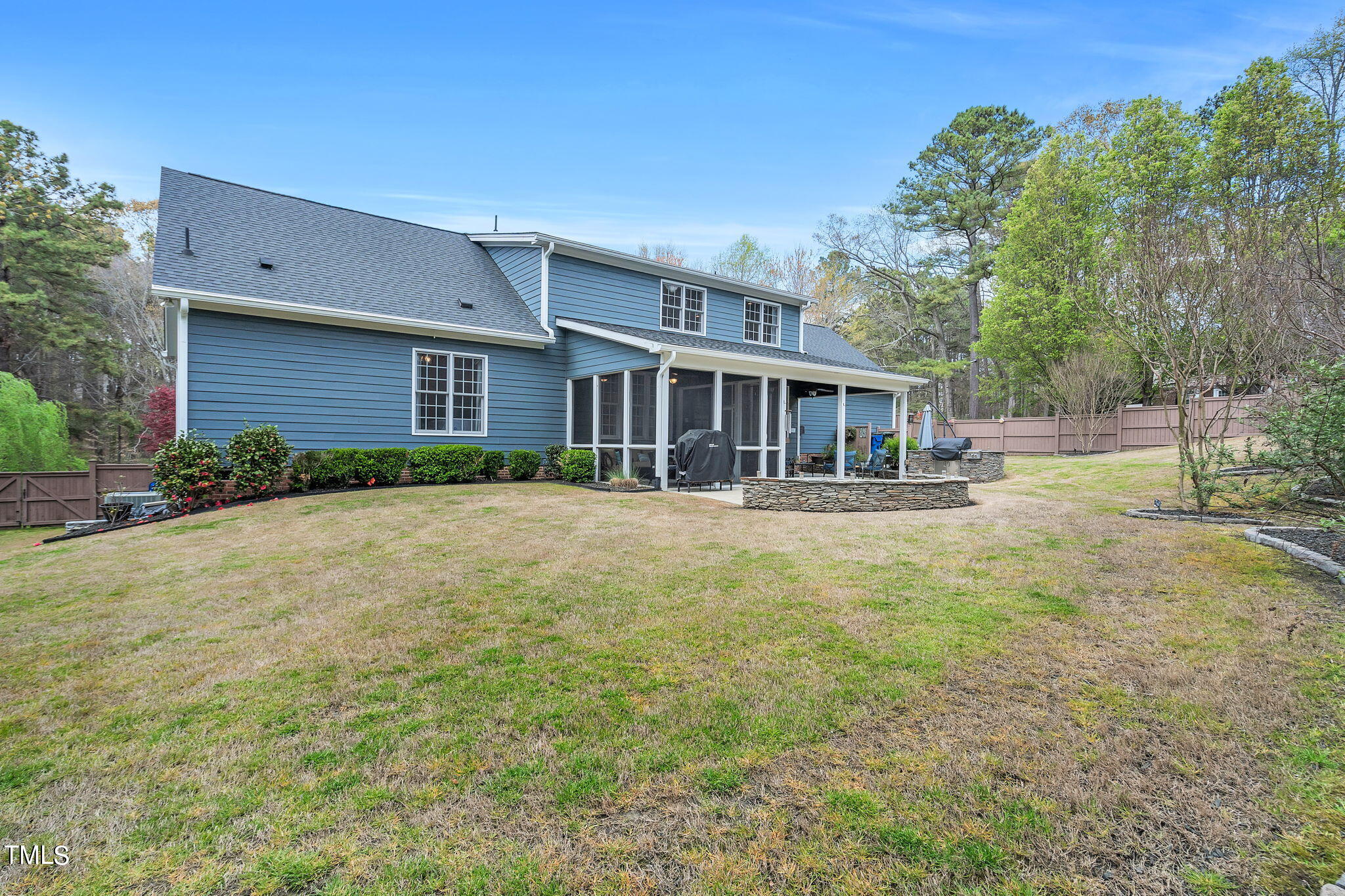 4301 Sprague Road Raleigh, NC 27613 - Photo 43 of 46 a front view of house with yard and trees in the background