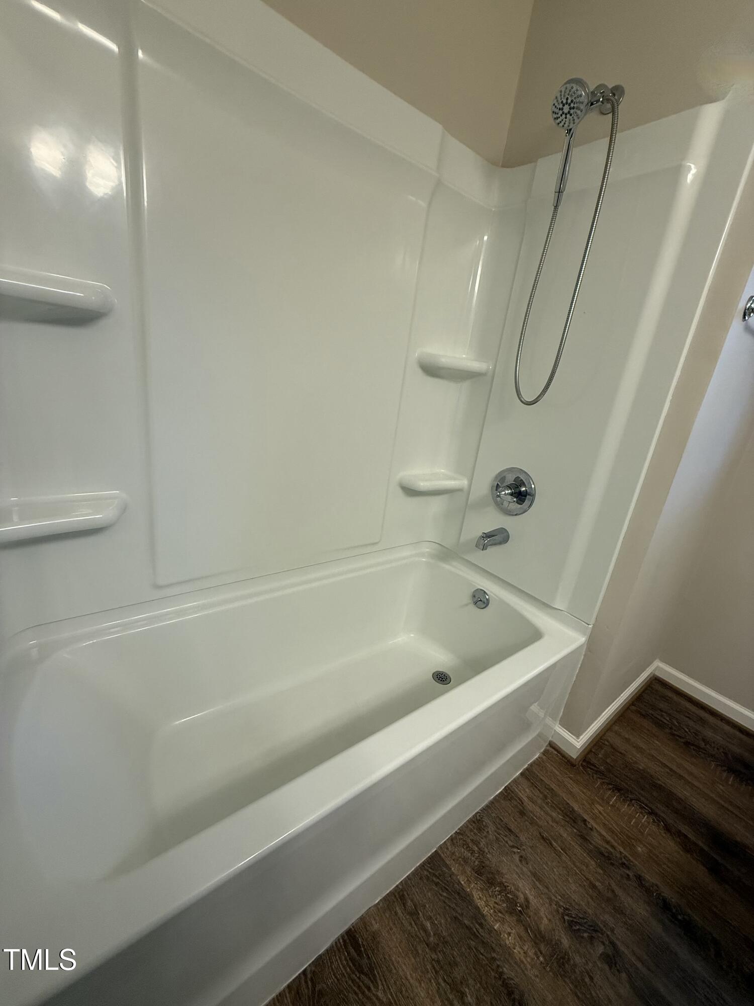 640 Crocker Road Smithfield, NC 27577 - Photo 15 of 28 a bathroom with a bath tub and a shower