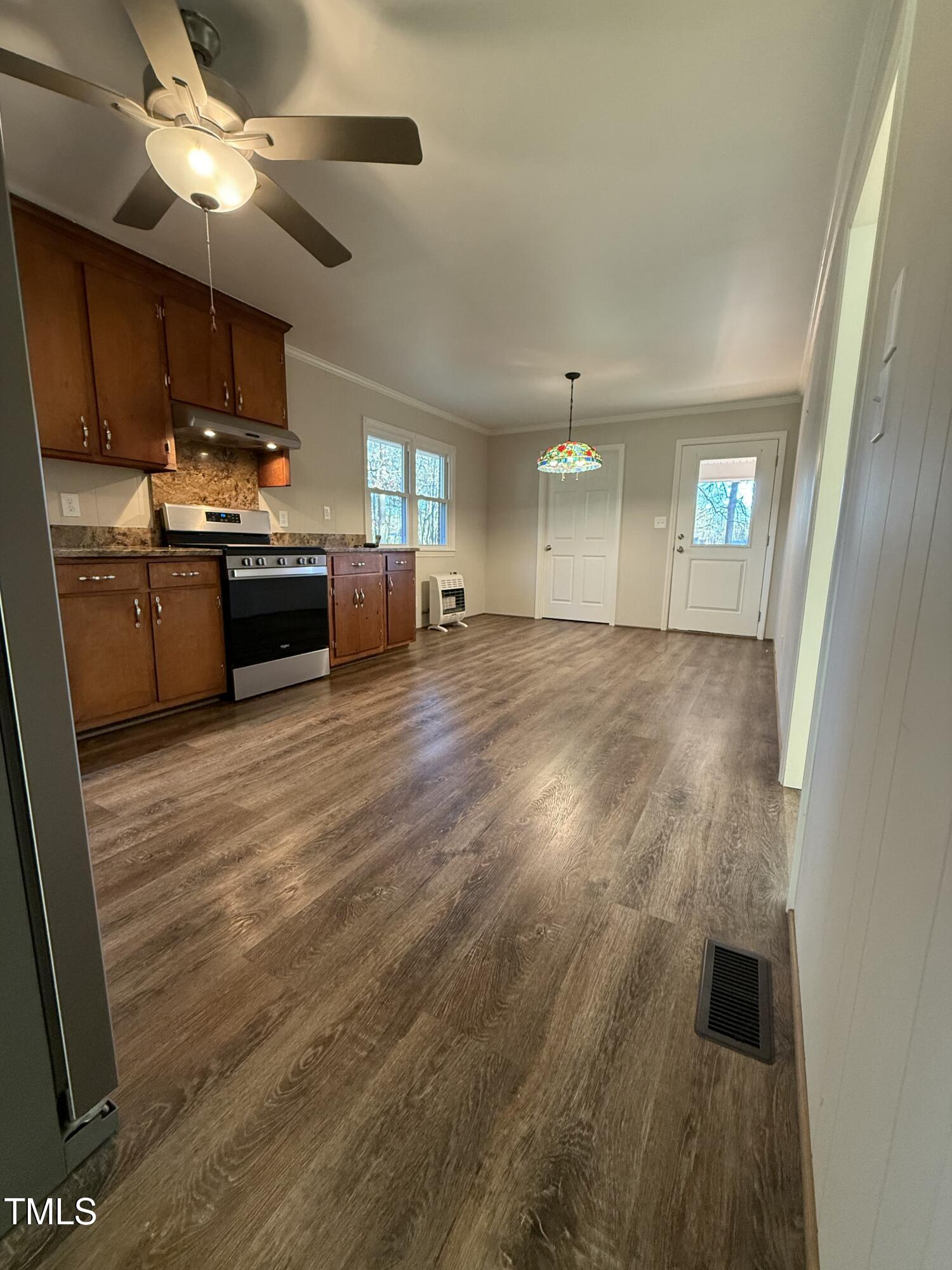 640 Crocker Road Smithfield, NC 27577 - Photo 16 of 28 a view of kitchen with sink and wooden floor