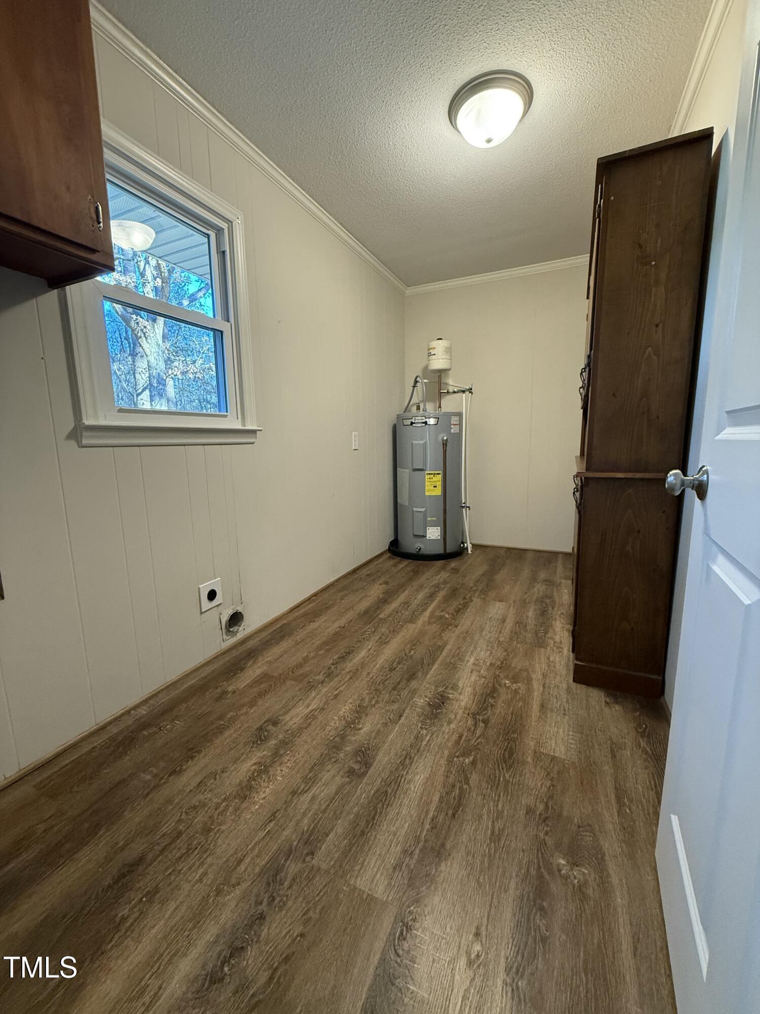 640 Crocker Road Smithfield, NC 27577 - Photo 17 of 28 a view of a storage & utility room with closet window
