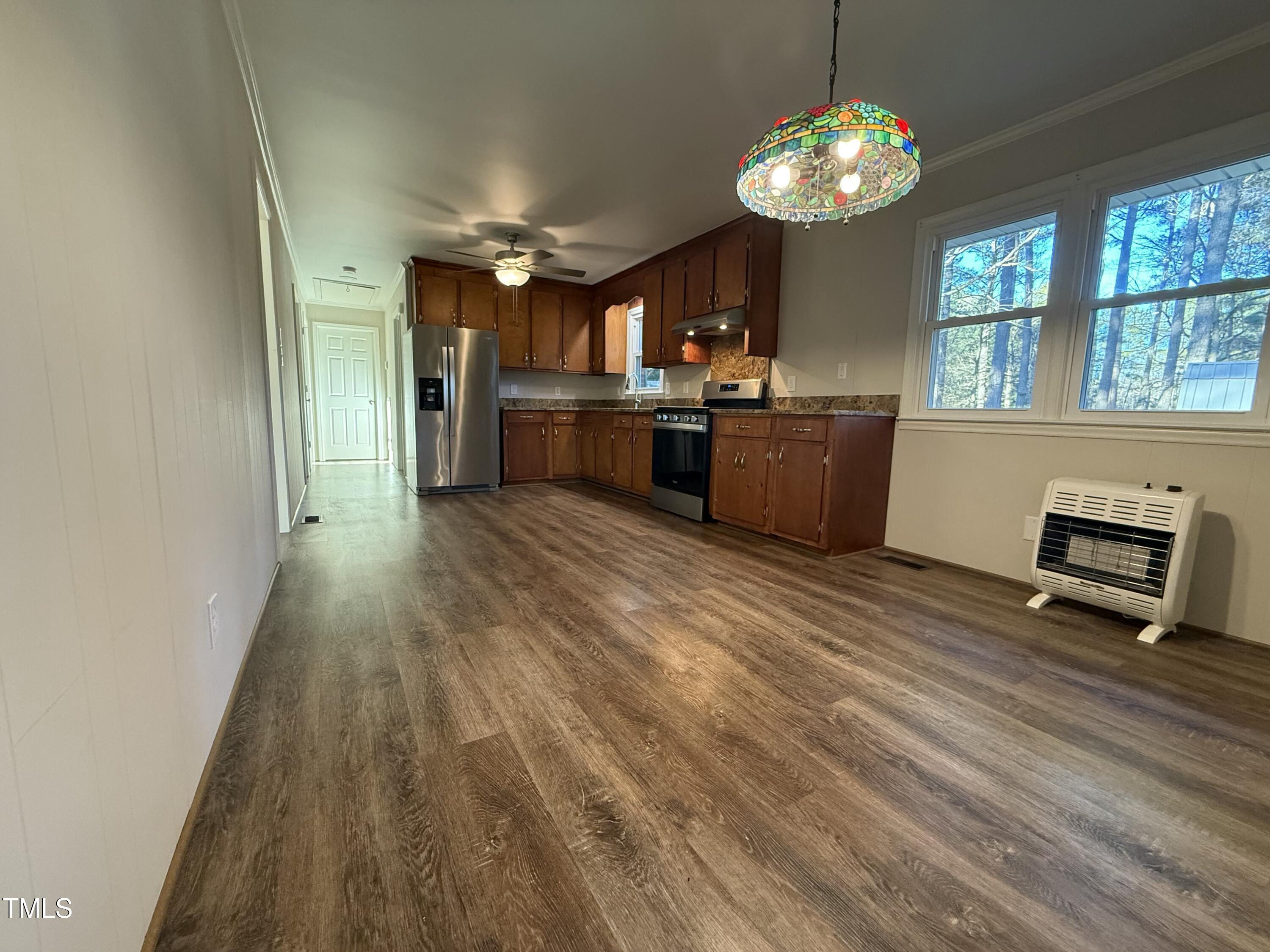 640 Crocker Road Smithfield, NC 27577 - Photo 18 of 28 a view of kitchen with sink microwave and refrigerator