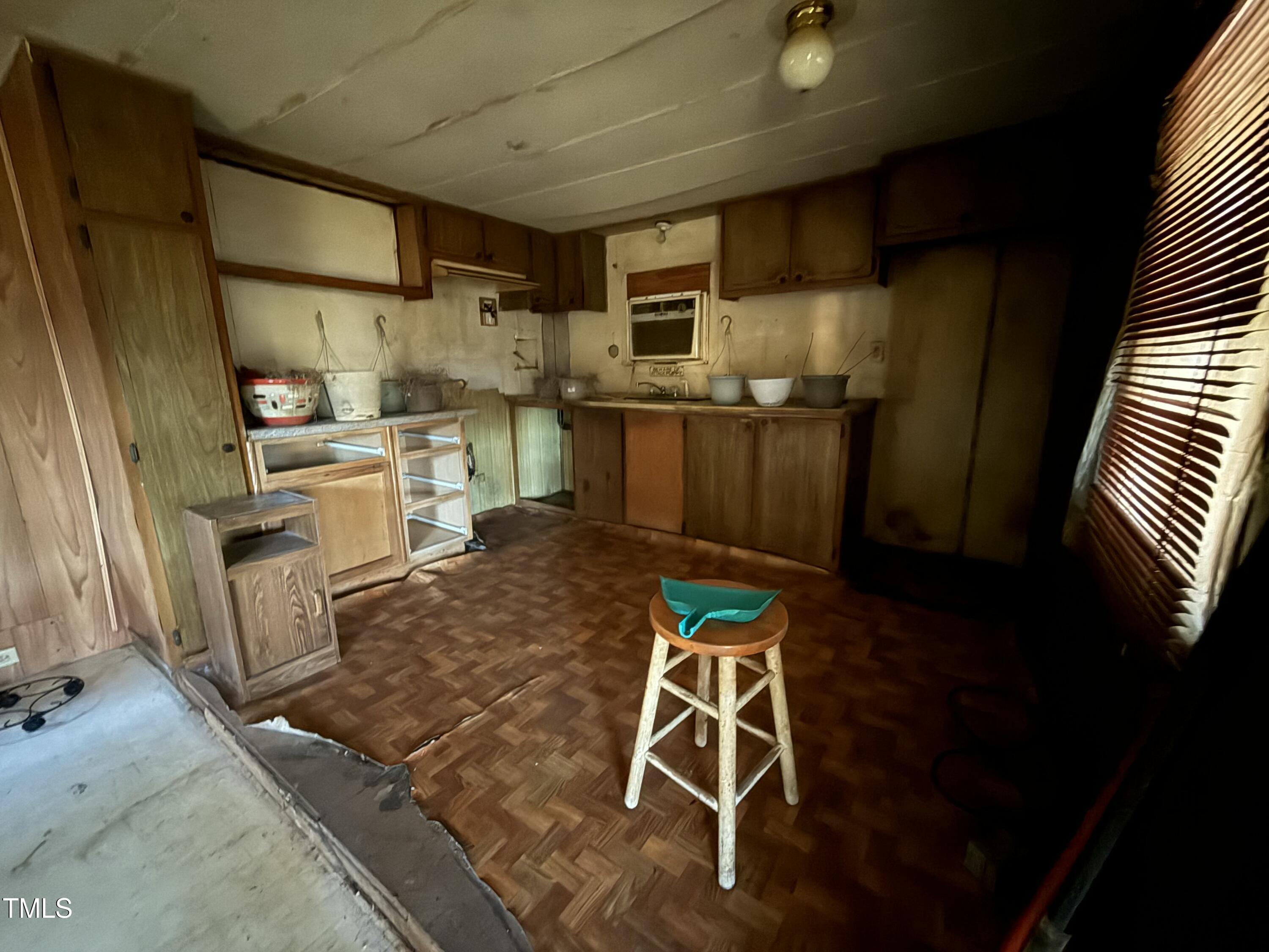 640 Crocker Road Smithfield, NC 27577 - Photo 25 of 28 a kitchen with granite countertop a sink appliances and cabinets