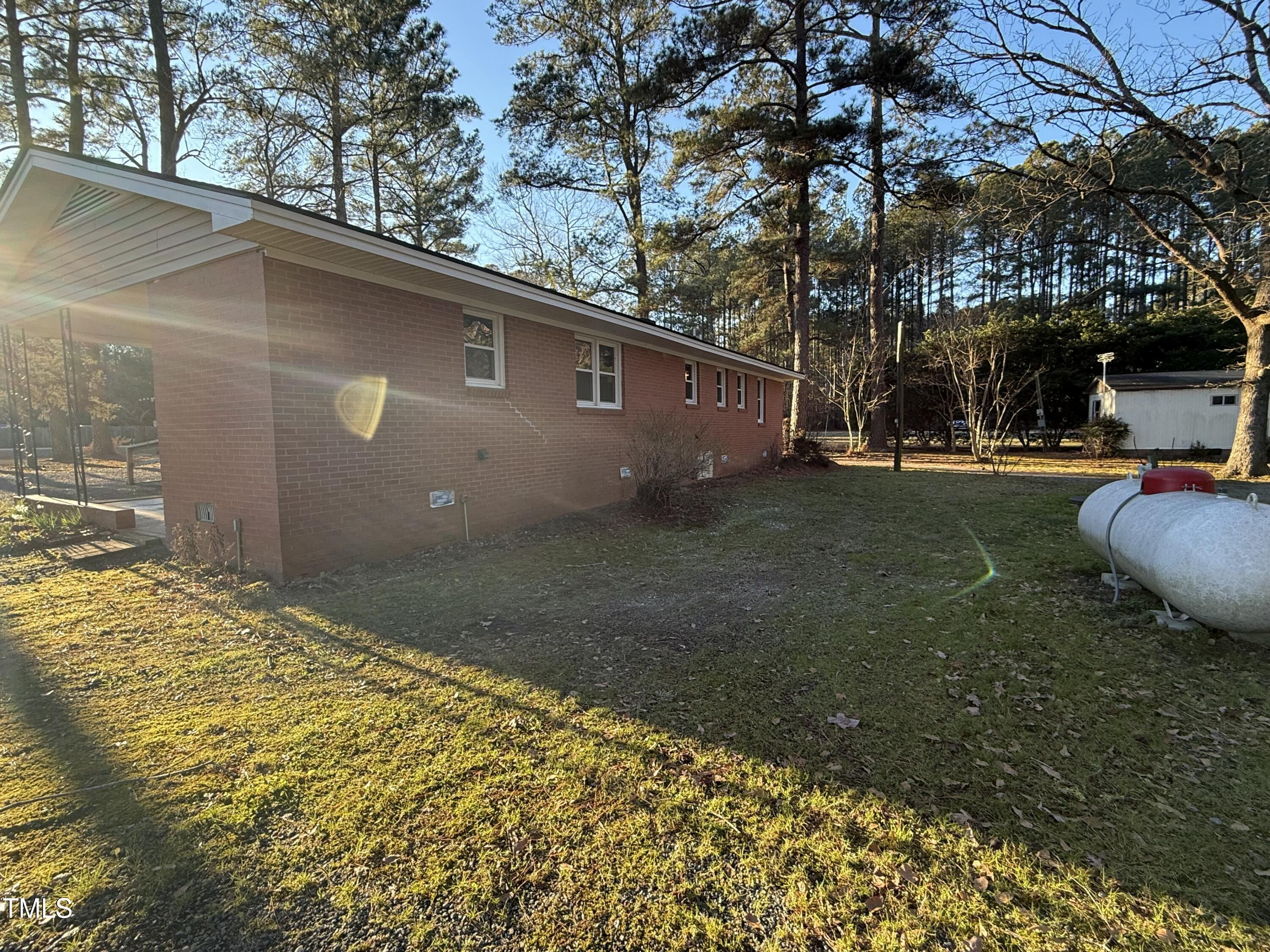 640 Crocker Road Smithfield, NC 27577 - Photo 5 of 28 a backyard of a house with table and chairs