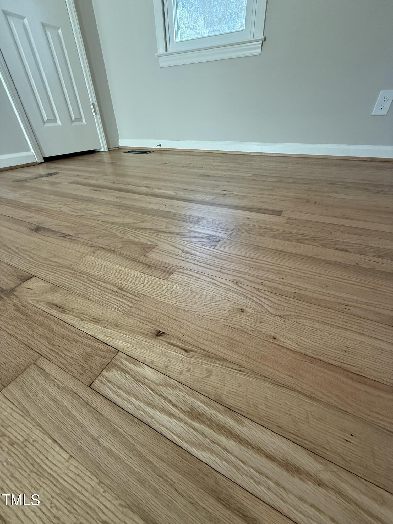 640 Crocker Road Smithfield, NC 27577 - Photo 10 of 28 a view of empty room with wooden floor