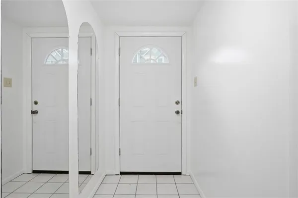 a view of an entryway with hallway