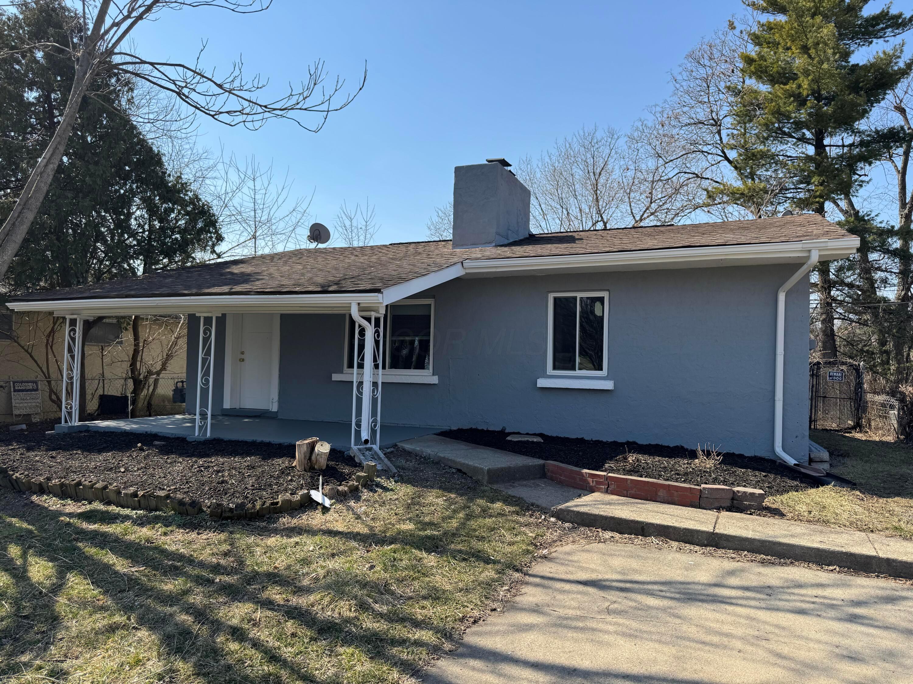 2499 Howey Road Columbus, OH 43211 - Photo 1 of 13 Front of house with parking area and front covered porch