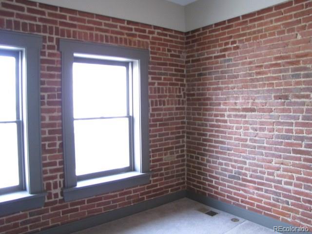 232 Broadway, Unit 2 Denver, CO 80203 - Photo 12 of 12 a view of empty room with windows