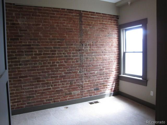 232 Broadway, Unit 2 Denver, CO 80203 - Photo 9 of 12 a view of empty room with windows