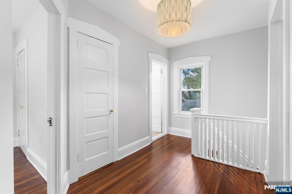 177 East Pierrepont Avenue Rutherford, NJ 07070 - Photo 18 of 27 a view of a hallway with wooden floor and staircase