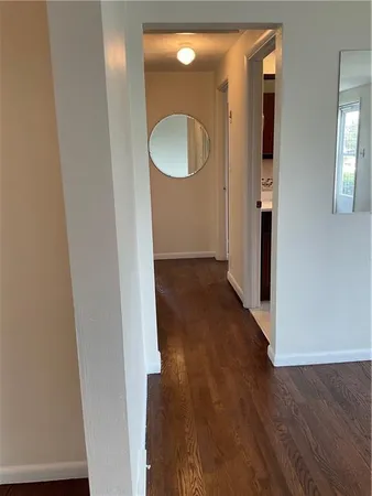wooden floor in a en suite bathroom with a sink