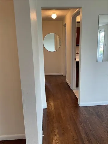 wooden floor in a en suite bathroom with a sink