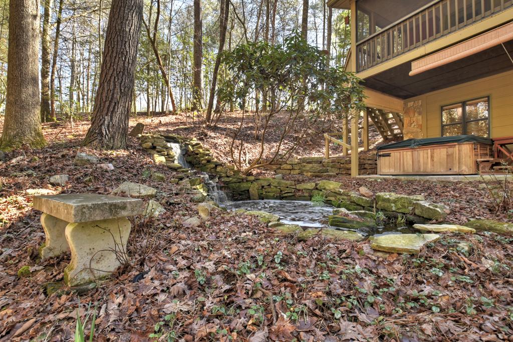 99 Cedar Ridge Road Cherry Log, GA 30522 - Photo 41 of 56 a backyard of a house with table and chairs