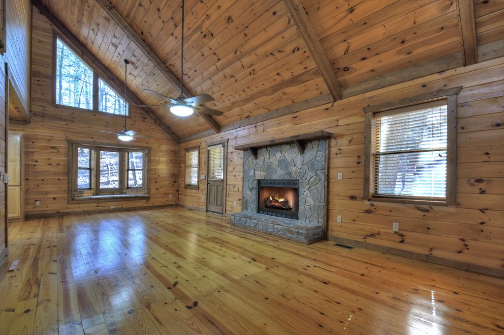 99 Cedar Ridge Road Cherry Log, GA 30522 - Photo 7 of 56 wooden floor in an empty room with a fireplace