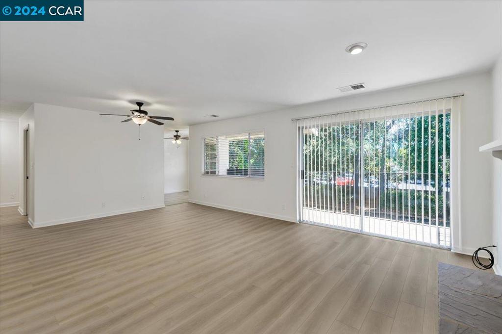 1050 Wesley Court Walnut Creek, CA 94597 - Photo 14 of 32 wooden floor in an empty room with a window