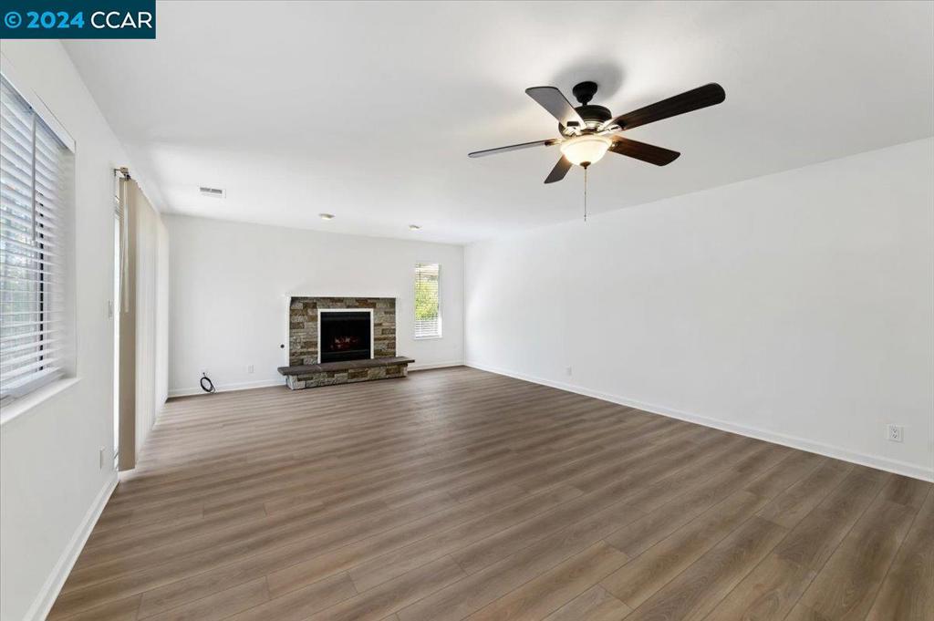 1050 Wesley Court Walnut Creek, CA 94597 - Photo 16 of 32 a view of empty room with wooden floor and fan