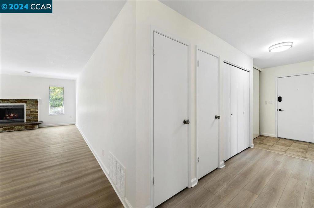 1050 Wesley Court Walnut Creek, CA 94597 - Photo 17 of 32 a view of empty room with wooden floor