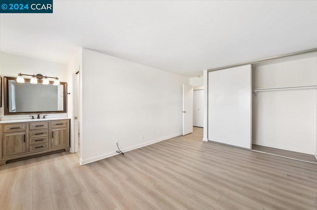 1050 Wesley Court Walnut Creek, CA 94597 - Photo 21 of 32 a view of a kitchen with wooden floor and electronic appliances