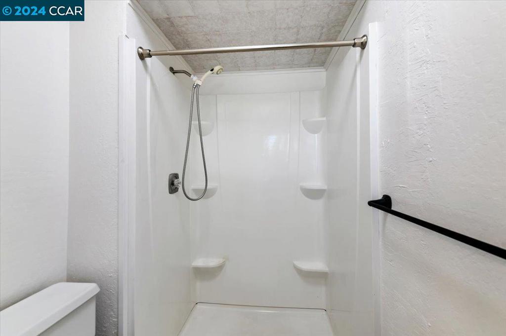1050 Wesley Court Walnut Creek, CA 94597 - Photo 23 of 32 a bathroom with a shower