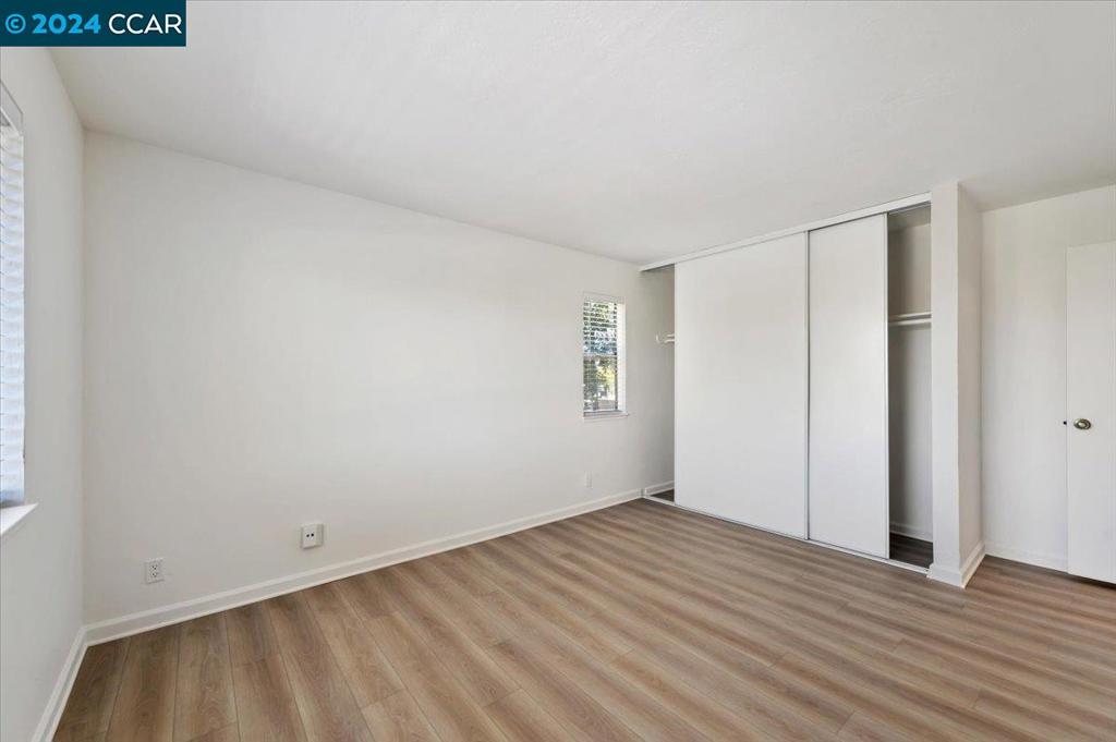1050 Wesley Court Walnut Creek, CA 94597 - Photo 29 of 32 a view of an empty room with wooden floor