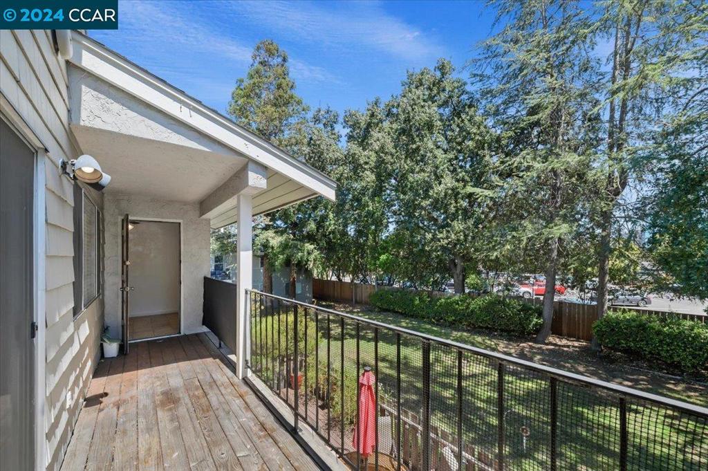 1050 Wesley Court Walnut Creek, CA 94597 - Photo 4 of 32 a view of a balcony with wooden floor