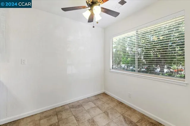a kitchen with a sink and a stove top oven with wooden floor