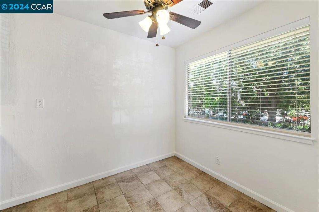 1050 Wesley Court Walnut Creek, CA 94597 - Photo 8 of 32 a view of an empty room with a window