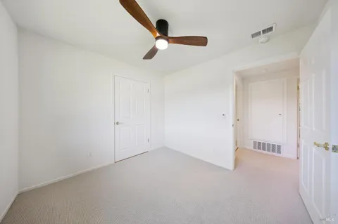 a bathroom with a double vanity sink and mirror