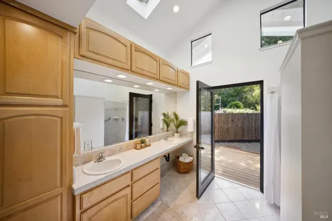 a view of a house with backyard swimming pool and sitting area