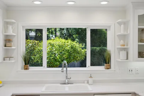 a view of a dining room with furniture window and outside view
