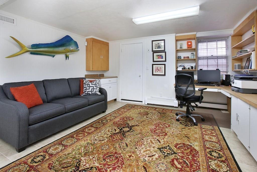 110 Arlington Road Brookline, MA 02467 - Photo 11 of 12 a living room with furniture and a rug