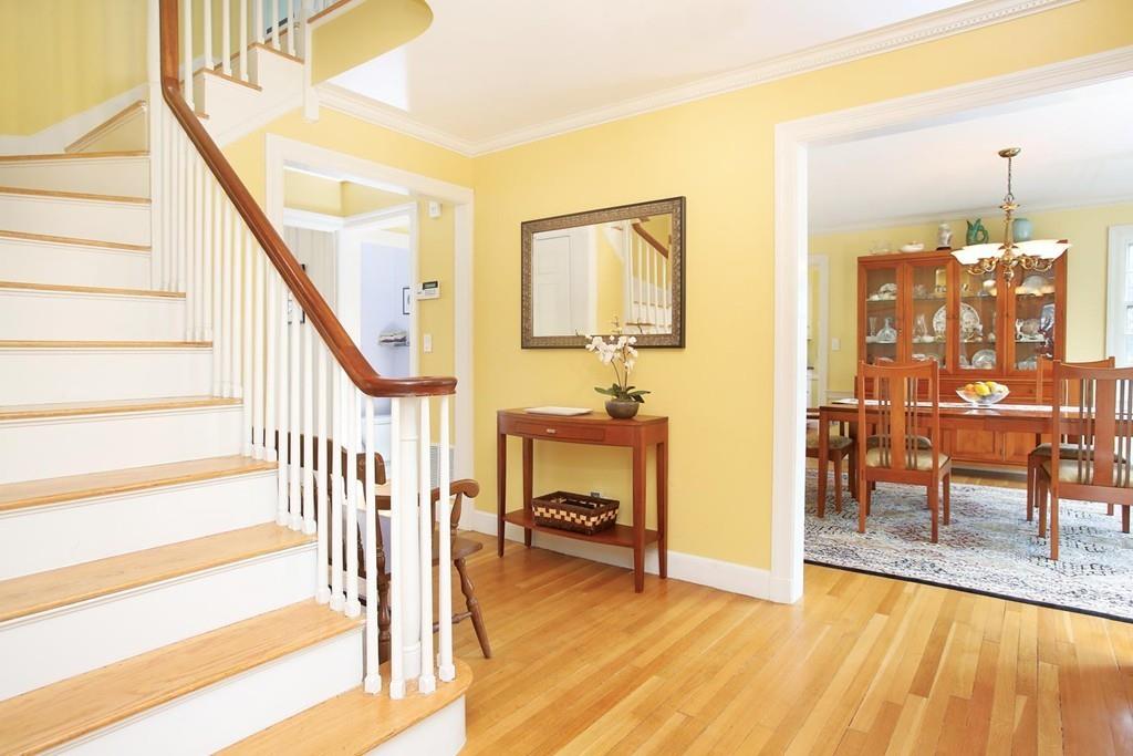 110 Arlington Road Brookline, MA 02467 - Photo 2 of 12 a view of a livingroom with furniture and a fireplace