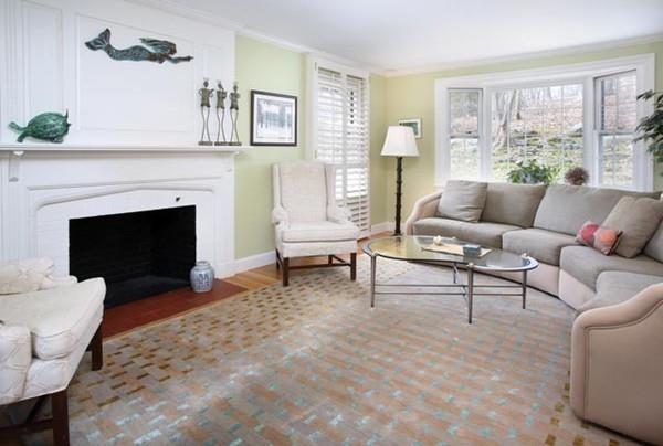 110 Arlington Road Brookline, MA 02467 - Photo 3 of 12 a living room with furniture and a fireplace