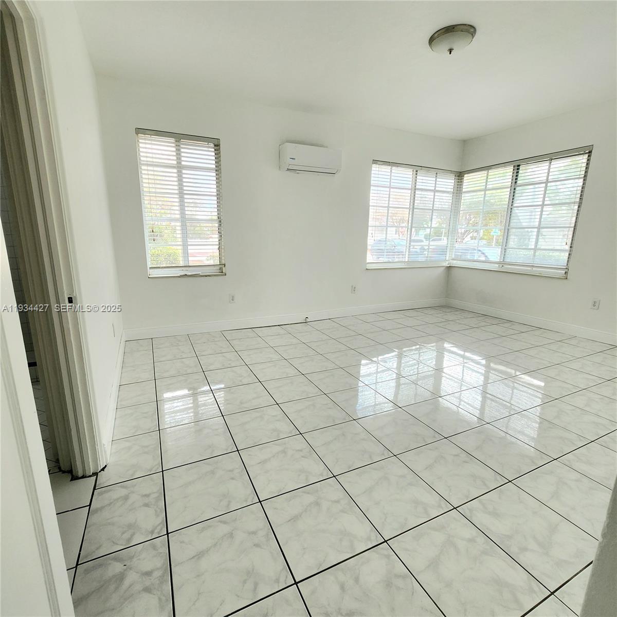 7936 Harding Avenue, Unit 4 Miami Beach, FL 33141 - Photo 11 of 12 a view of an empty room with a window