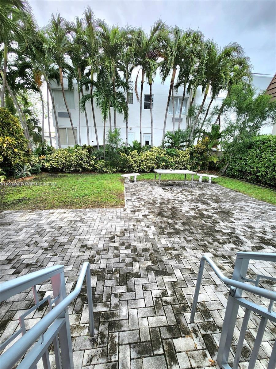 7936 Harding Avenue, Unit 4 Miami Beach, FL 33141 - Photo 2 of 12 a backyard of a house with lots of green space