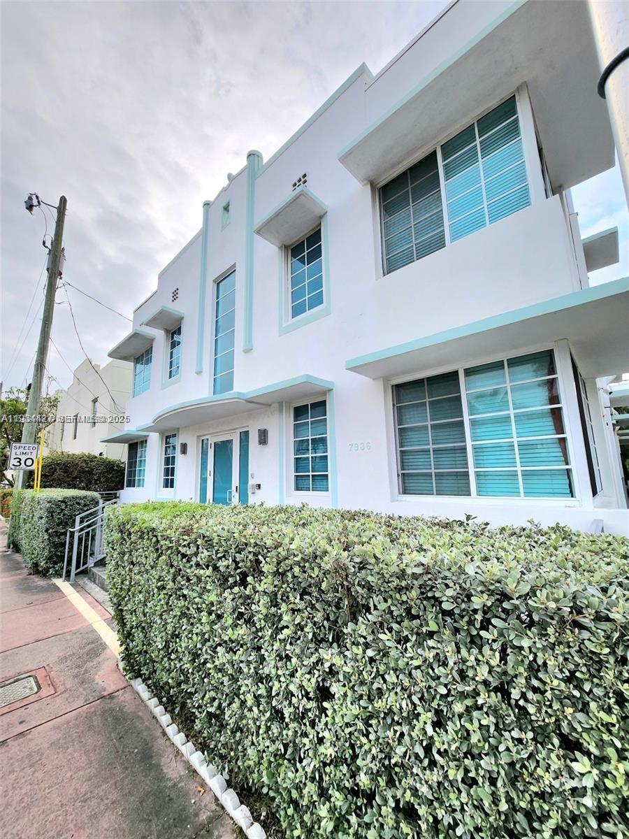 7936 Harding Avenue, Unit 4 Miami Beach, FL 33141 - Photo 3 of 12 a house view with a garden space