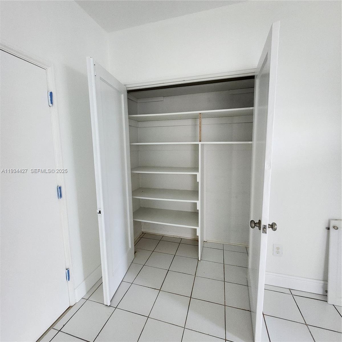 7936 Harding Avenue, Unit 4 Miami Beach, FL 33141 - Photo 6 of 12 a view of an empty walk in closet