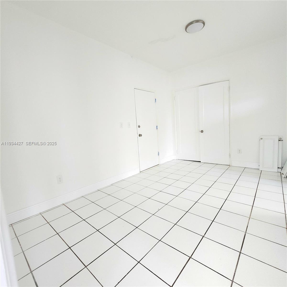 7936 Harding Avenue, Unit 4 Miami Beach, FL 33141 - Photo 8 of 12 a view of a room and window