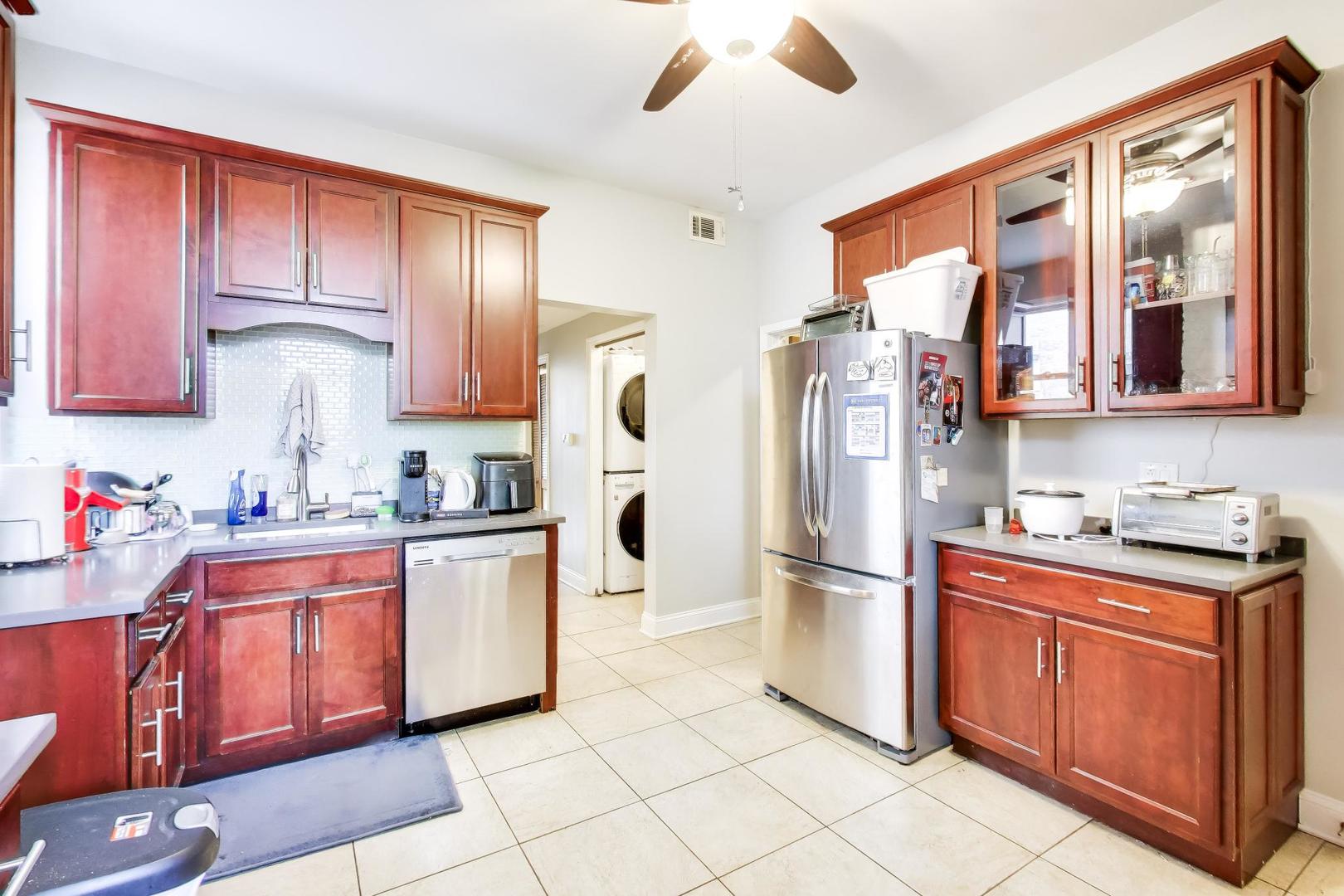 3519 North Seminary Avenue Chicago, IL 60657 - Photo 16 of 43 a kitchen with stainless steel appliances granite countertop a refrigerator and a stove top oven