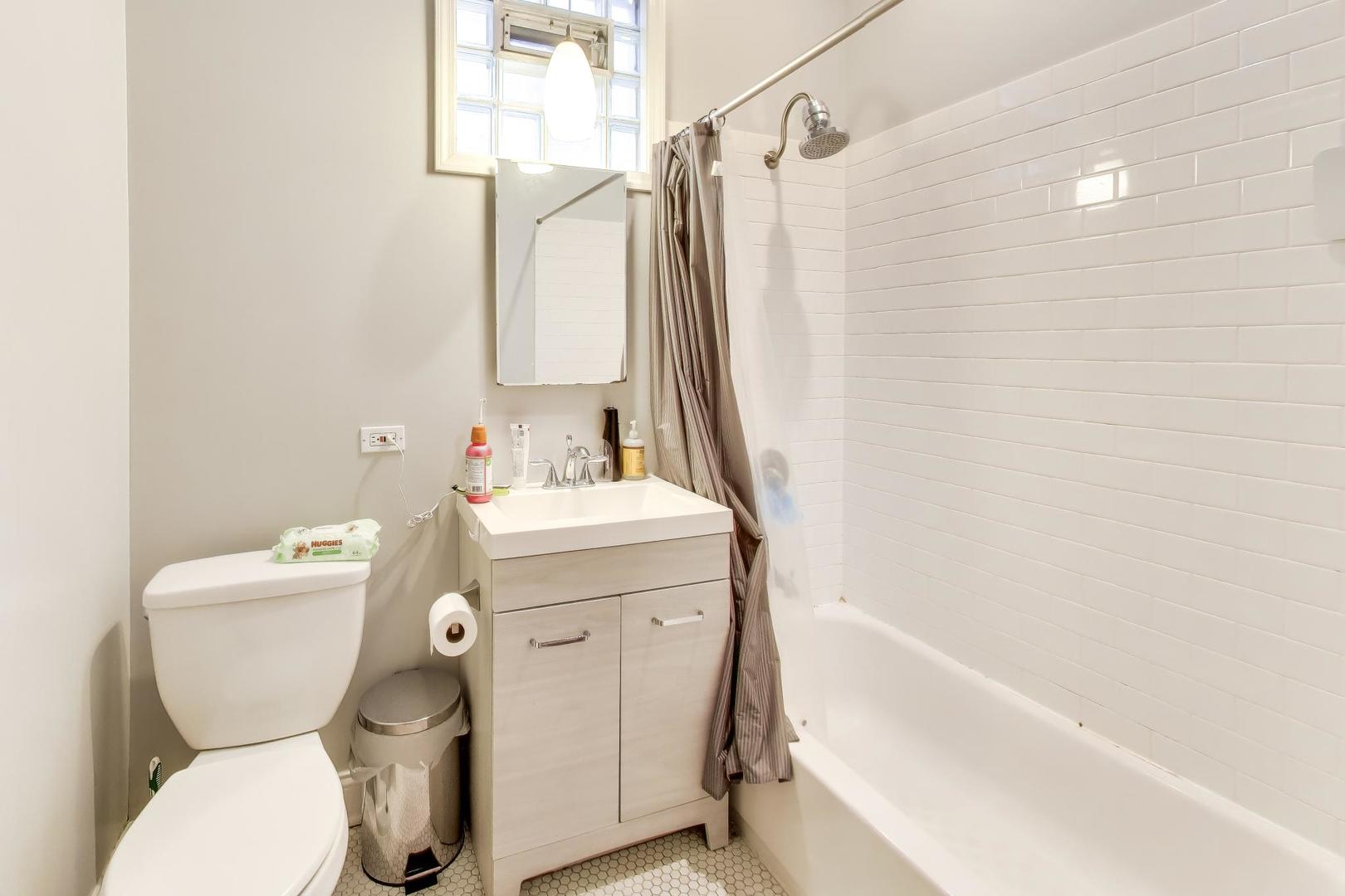 3519 North Seminary Avenue Chicago, IL 60657 - Photo 20 of 43 a bathroom with a sink toilet and shower