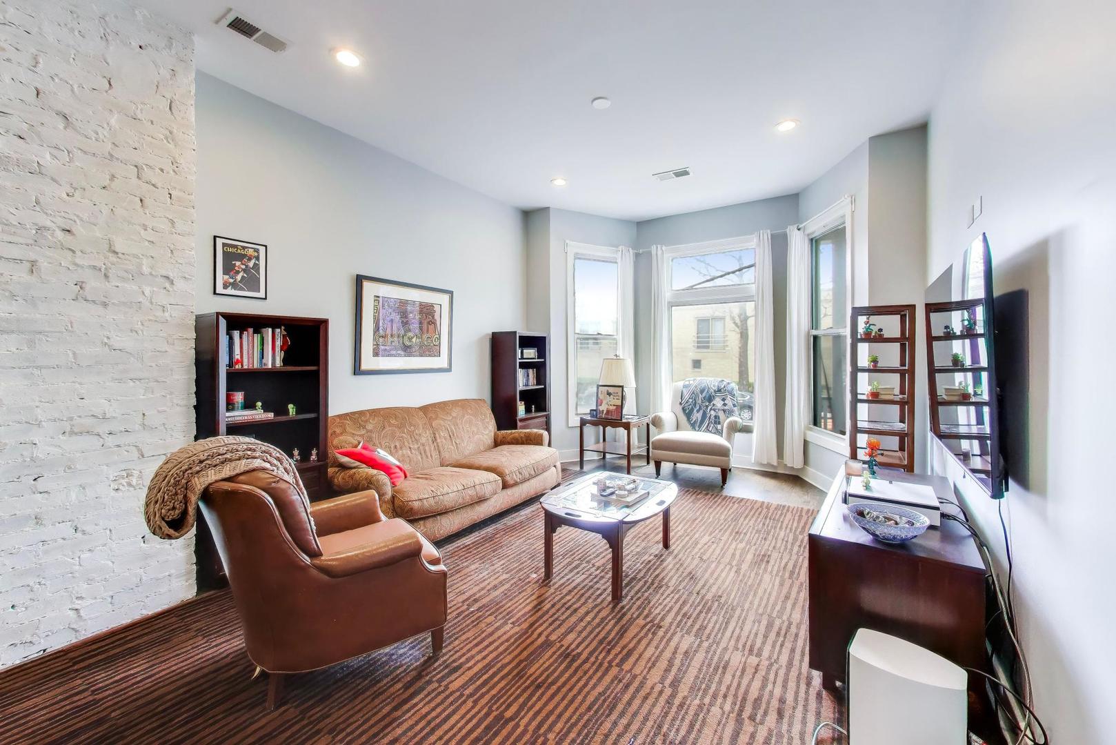3519 North Seminary Avenue Chicago, IL 60657 - Photo 2 of 43 a living room with furniture a rug and a wooden floor