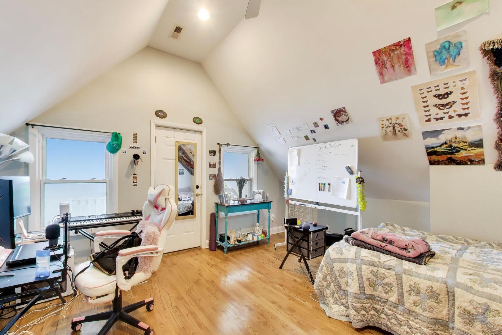 3519 North Seminary Avenue Chicago, IL 60657 - Photo 29 of 43 a bedroom with furniture and a wooden floor