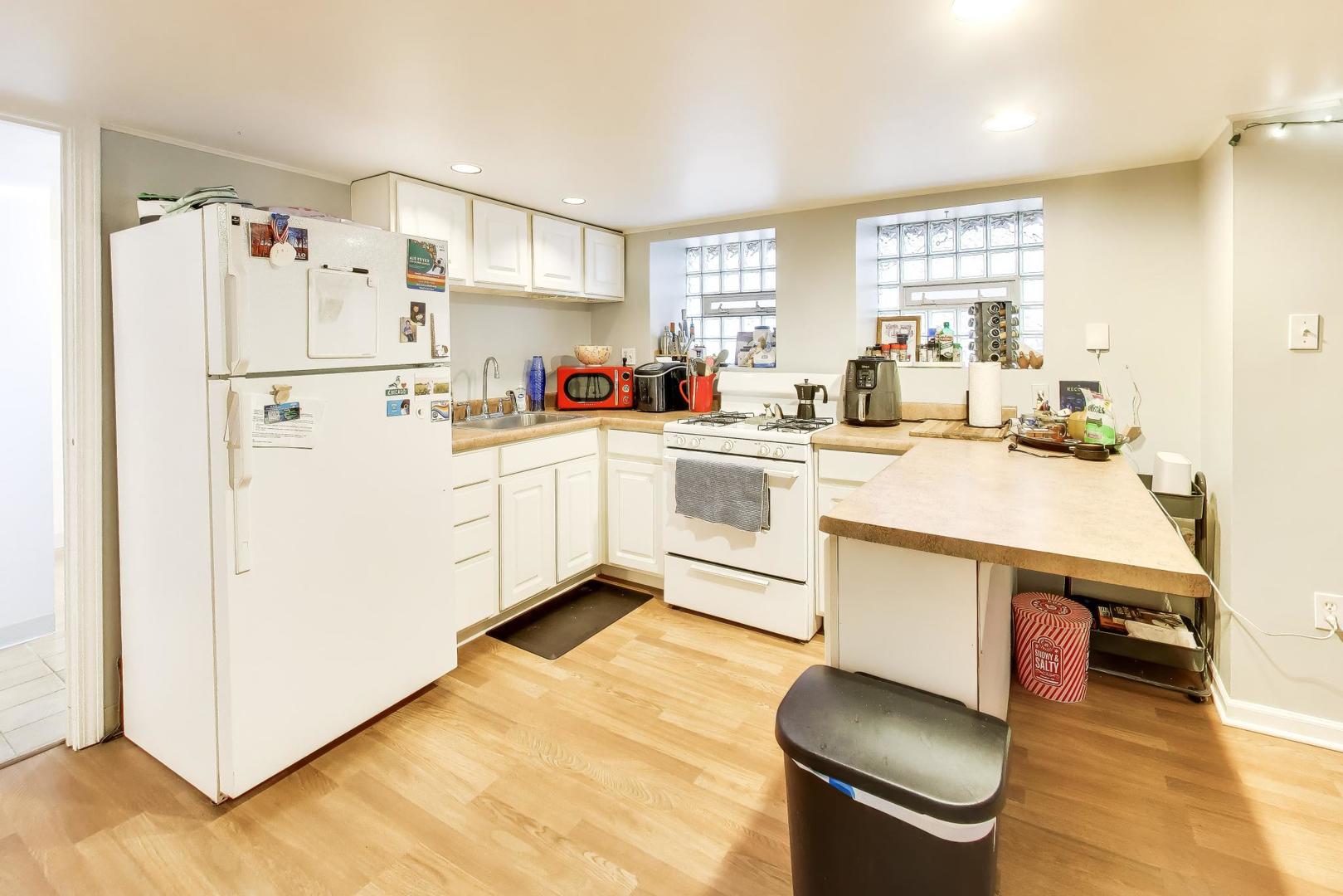 3519 North Seminary Avenue Chicago, IL 60657 - Photo 33 of 43 a kitchen with a sink appliances and cabinets